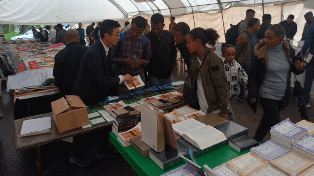 People looking at the books