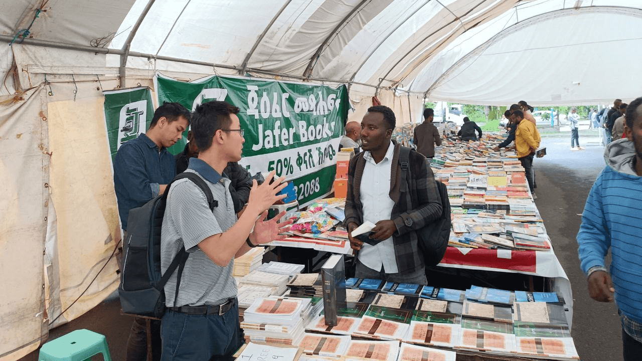 People looking at the books